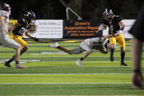 Sophomore Andrew Cody makes a tackle against one of the Mountaineers at the game in Tuscola on Friday, Sept. 8. Swain County won the game 30-26.
