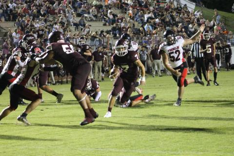 Maroon Devil James Stroman tries to outrun opponents at the Sept. 1 game played at home.