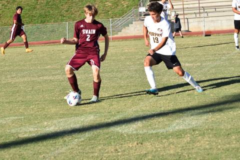 Maroon Devil Clayton Shuler, junior, gains control of the ball in the home tie against the Murphy Bulldogs. The next game is Monday at Andrews.