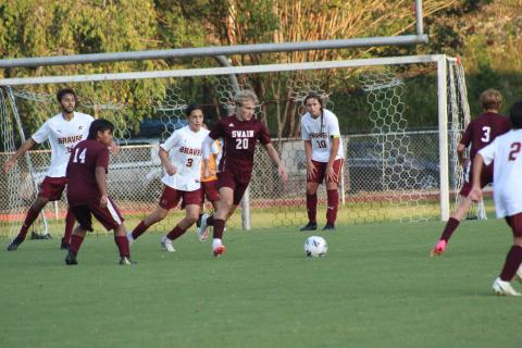 Maroon Devils freshman Abraham Pena (from left), senior Owen Craig and sophomore Evan Hall battle it out for the ball against members of the visiting Cherokee Braves at the home soccer game on Monday, Sept. 18.