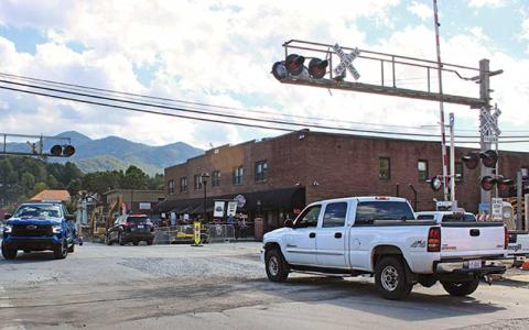 Larry Griffin/SMT - Trucks drive through Everett Street on Tuesday, Oct. 10 as the construction has begun moving up the road, opening off the part of the street that was closed for the last two months.