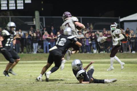 Josh Collins (from left) and Josiah Glaspie get in the fray at the football game in Robbinsville on Friday, Oct. 27, in which the Devils lost 14-8 and broke their winning streak for the season after several games.