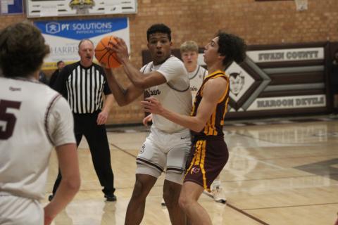 Maroon Devils senior Reese Winchester makes a run for it with the ball at the Friday, Jan. 5 game against Cherokee.