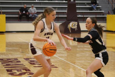 Freshman Emily Stargell maneuvers around the Lady Wildcats’ defense at the championship game taking place in Cherokee Thursday, Feb. 15.
