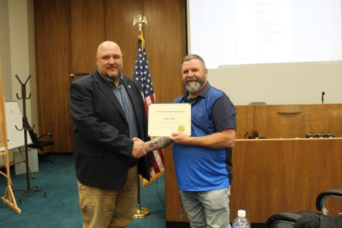 County Manager Kevin King (left) bid farewell to the county at the March 19 commissioners’ meeting. Commission Chairman Kevin Seagle presented him with a Certificate of Appreciation. King has worked for the county for 28 years. On April 1, he will start his new position as the county manager for Jackson County.
