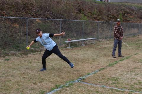 Sally Hall competes in the softball throw competition. 