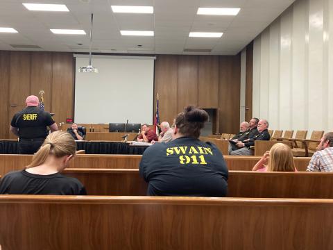 Swain County Sheriff’s Department Lieutenant Scott Barnes speaks before the commissioners about the need to increase wages for county employee