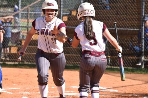 Lady Devils Maddie Bird and Makenzee Bird share a celebratory high-five during the win against Hiwassee Dam last week. 
