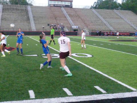 Player of the Game Karena Cline with a pass to Isabella Walker in the seeding victory.