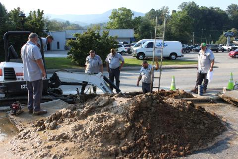 town public works department fix a water main break.