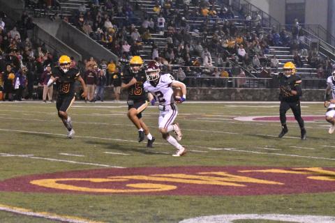 Maroon Devil Corey Stillwell on the carry early in the game against the Braves.