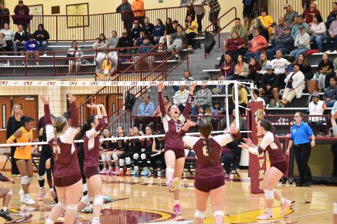 The Lady Devils celebrate after a victory against Cherokee Lady Braves.