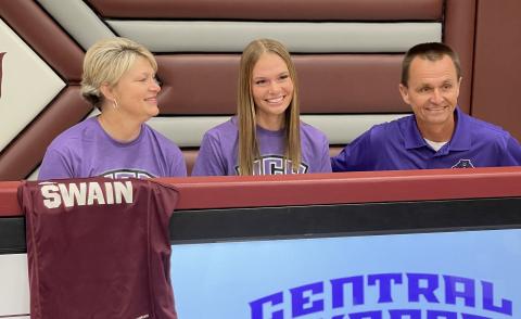 Arizona Blankenship, a Swain High senior, signed her letter of intent to attend Central Arkansas University and run cross country and track in a ceremony at the Swain High gym on Friday, Nov. 15. She's pictured here with her parents, Sonya and Neil. 