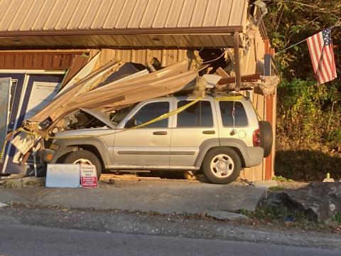 A woman has been charged with driving while impaired after crashing a vehicle into Ridgeline Mechanical on Main Street in Bryson City.