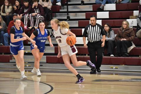 Lady Devil Emily Stargell, sophomore, considers her next move in the heated game against the Lady Eagles. 