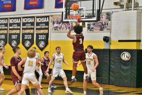 Devil Jayden Smiley delivers a basket in the away game against the Bulldogs, which ended in a 75-39 loss for the Devils. 