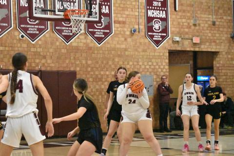 Lady Maroon Devil Faith Woodard looks to pass in the home game against Highlands. 