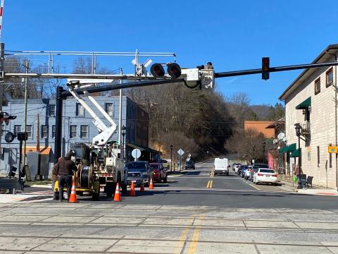 Subcontractors put up a mast arm pole on Everett Street earlier this week.