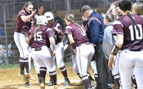 Photos /Joanna McMahan.  Faith Woodard rips a home run with 3 hits and 3 RBIs against the Lady Mountaineers Friday, March 7. Swain led 7-5 going into the final stanza, but the Lady Mountaineers scored 3 runs in the last inning for the win.
