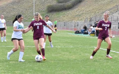Photo/Joanna McMahan.  Audrey Monteith works the ball past a Bobcat defender Thursday, April 3. The Lady Devils have moved to 6-0 in the conference and 9-1 overall.