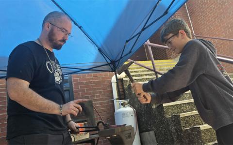 SMT photo/ Sara Eisinger.  Jesse Bolden teaches how metal moves with Jackson County Green Energy Park at the Gear Up SMS STEAM Expo. Thursday, April 24. Gear Up serves Swain County middle and high school students by offering a variety of events, activities and resources.