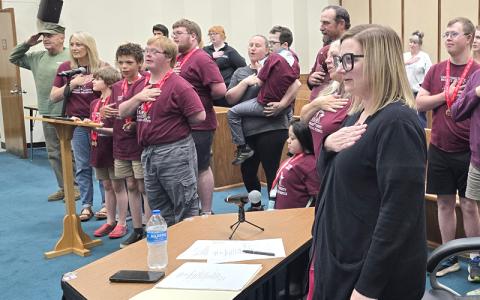 SMT photo/Sara Eisinger.  Nolan Griggs leads the Pledge of Allegiance. 
