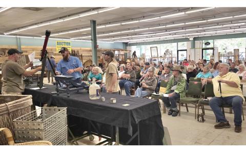 SMT photos/Sara Eisinger. Buttermilk Farms Antiques & Auction seats nearly 200 people during its monthly auction Saturday, May 24. Meanwhile, Susan Leading Fox, owner, ran a successful cake auction fundraiser to thank fire crews.
