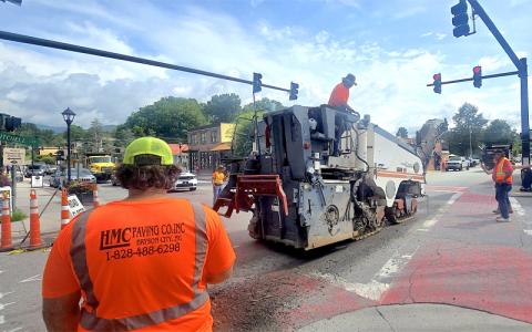 SMT photo/Sara Eisinger.  HMC Paving Co. works on Mitchell Street, from Slope to Everett streets Monday, June 16. Work continues at Carringer Street.