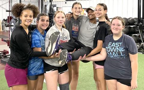 Photo/Joanna McMahan.  Swain High School Varsity Basketball Coach Nadia Marshall, center, is carried away by six Lady Devils at the school’s gym last week. 15 Lady Devils participate in Marshall’s basketball camp. 