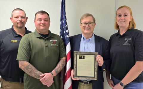 SMT photo/Sara Eisinger.  Swain County Sheriff’s Office Chief Deputy Brian Kirkland (left to right), Lt. Det. Kevin Bryson, North Carolina Gang Investigators Association Region 1 coordinator, Assistant District Attorney James “Jim” Moore and NCGIA Vice President Jenni Holste hold a short award presentation for Moore who was nominated Region 1 Prosecutor of the Year.