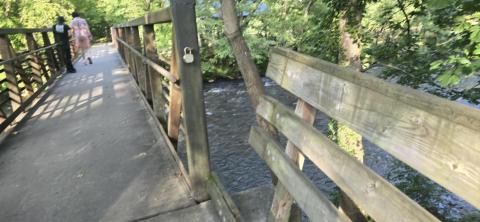 SMT photo/Sara Eisinger. A wooden guardrail at the Island Park bridge’s entrance pulled apart Saturday, July 5.
