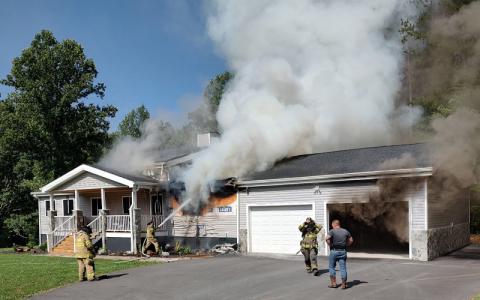 Photo/Charles Bryson.   Bryson City Fire Department responds to a structure fire on Jackson Line in the Tuckasegee Fire District Saturday, June 28. The call came in at approximately 10:15 a.m. and crews were able to prevent further fire damage.