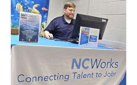 Submitted photo.  Beau Busby, career advisor II for Jackson and Swain counties, works out of the Marianna Black Library location Tuesday, Aug. 12. NCWorks is open to Swain County residents at the library every Tuesday and Thursday from 10 a.m. to 4:30 p.m.