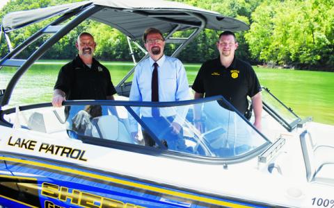 Photo/Kevin Hensley.  A new search and rescue boat – for use in both Graham and Swain counties – was unveiled on the shores of Fontana Lake on Aug. 14. From left are Graham County Sheriff Brad Hoxit; Rep. Chuck Edwards (R-Hendersonville), who helped obtain the funding to purchase the boat; and Swain County Sheriff Brian Kirkland. 