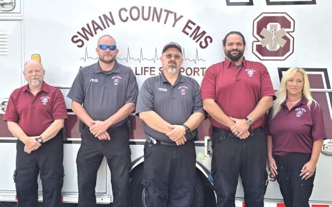 SMT photo/Sara Eisinger.  Swain County EMS first responders Steve Pack, Brandon Wiggins, Jon Waldroup, Ian McCauley and Earlene Leonard remember 9/11 outside the EMS building Sept. 5. 