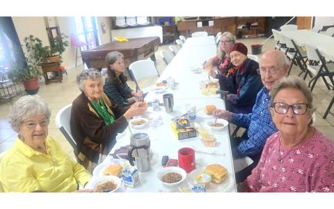 SMT photo/Sara Eisinger.  Gail Dellinger (left, front to back), Jeanette Frady, Linda Vaughn; (right, front to back) Margaret McCurry, Richard Schaddelee, Judy Stroup and Sandy Estep congregate for lunch at Swain Senior Center Monday, Sept. 15.