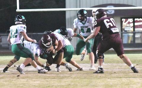 Photo/Joanna McMahan.  Druw Cody runs the ball under Swain High’s Friday night lights during Friday’s home game. 