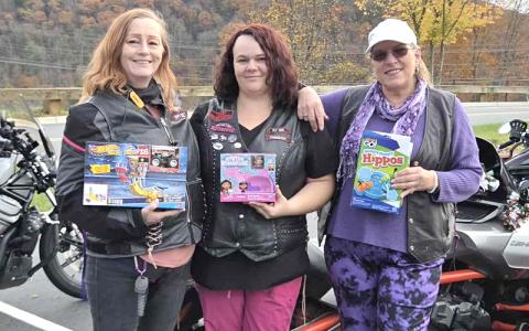 Submitted photo.  Chrome Angels Misty Dawn (left to right), Heather Osborne and Shelly Gable seek to bring Christmas joy to every child in Swain County.