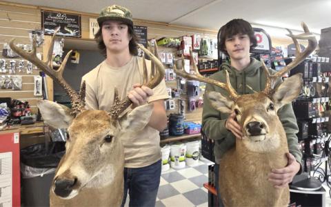 Photo submitted.  Skye Woodard and Corbin Cochran display their whitetail mounts at Great Smokey Mountain Bait and Tackle aka Jack’s Nov. 18. 