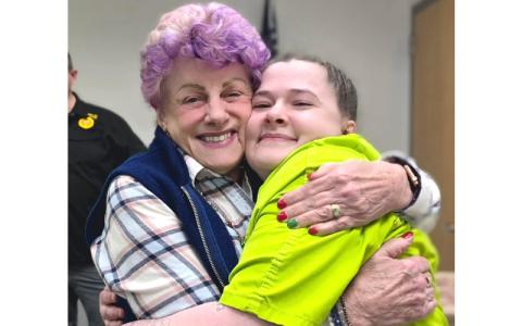 SMT photo/Sara Eisinger.  Kaye McConnell congratulates Chasity Taylor, who just earned a certificate of completion from Sunrise Community for Recovery and Wellness, with a big hug Dec. 18. 