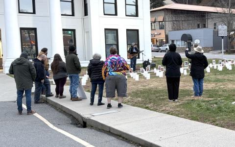 Submitted photo. About 30 county residents gather to honor individuals who died while in ICE custody or following encounters with federal immigration agents at The Square at Everett and Main streets Jan. 17.