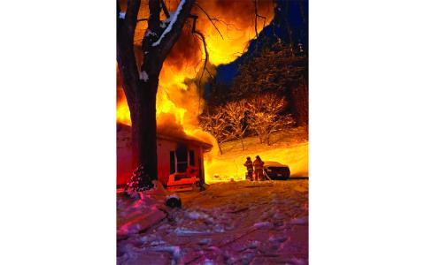 Submitted photo.  A fire destroys a family home in Beck Cove Jan. 31.
