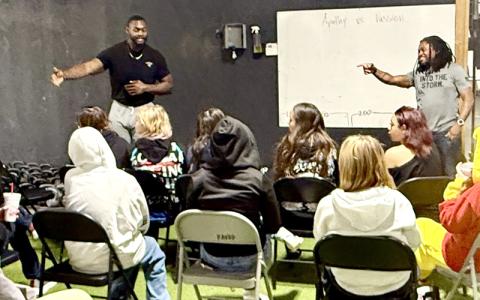 Submitted photo.  Coaches Jeff Epps (left to right) and Danny Antoine instruct Swain Academy students at Kavod Fitness in Franklin in Feb. 