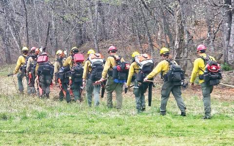Forest Service photo/Matt Switzer.  Fire crew hiking to the fire line.