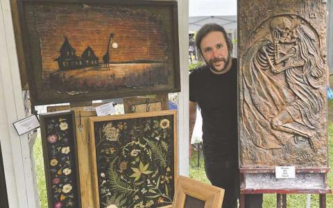 Erich Atkins of Von Fader Studios showcases copper relief art at Smoky Mountain Farmers and Artisans Market May 22.