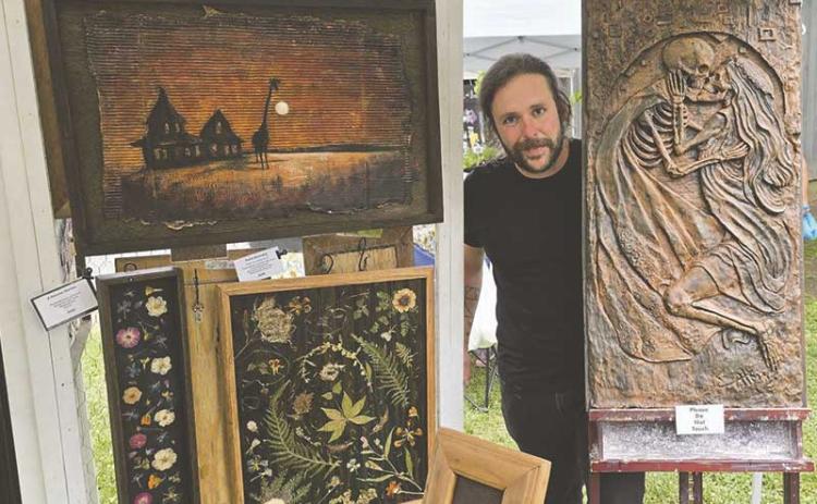 Erich Atkins of Von Fader Studios showcases copper relief art at Smoky Mountain Farmers and Artisans Market May 22.