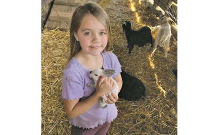 Photo submitted - Peyton shows off her family’s petting zoo in March 2023.