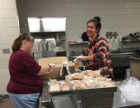 Nutrition workers with Swain Schools pack meals