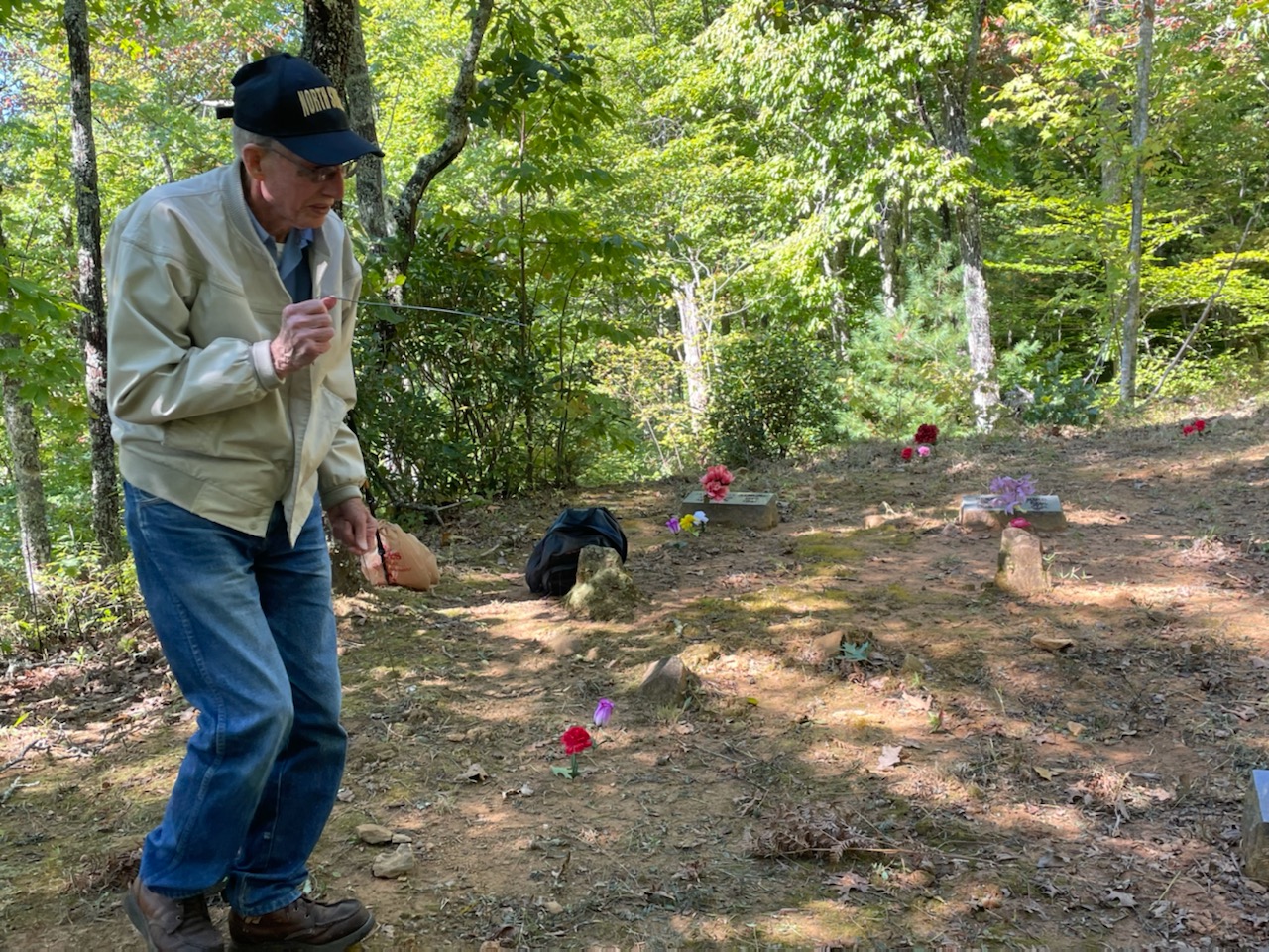 James Calhoun demonstrates dowsing a grave