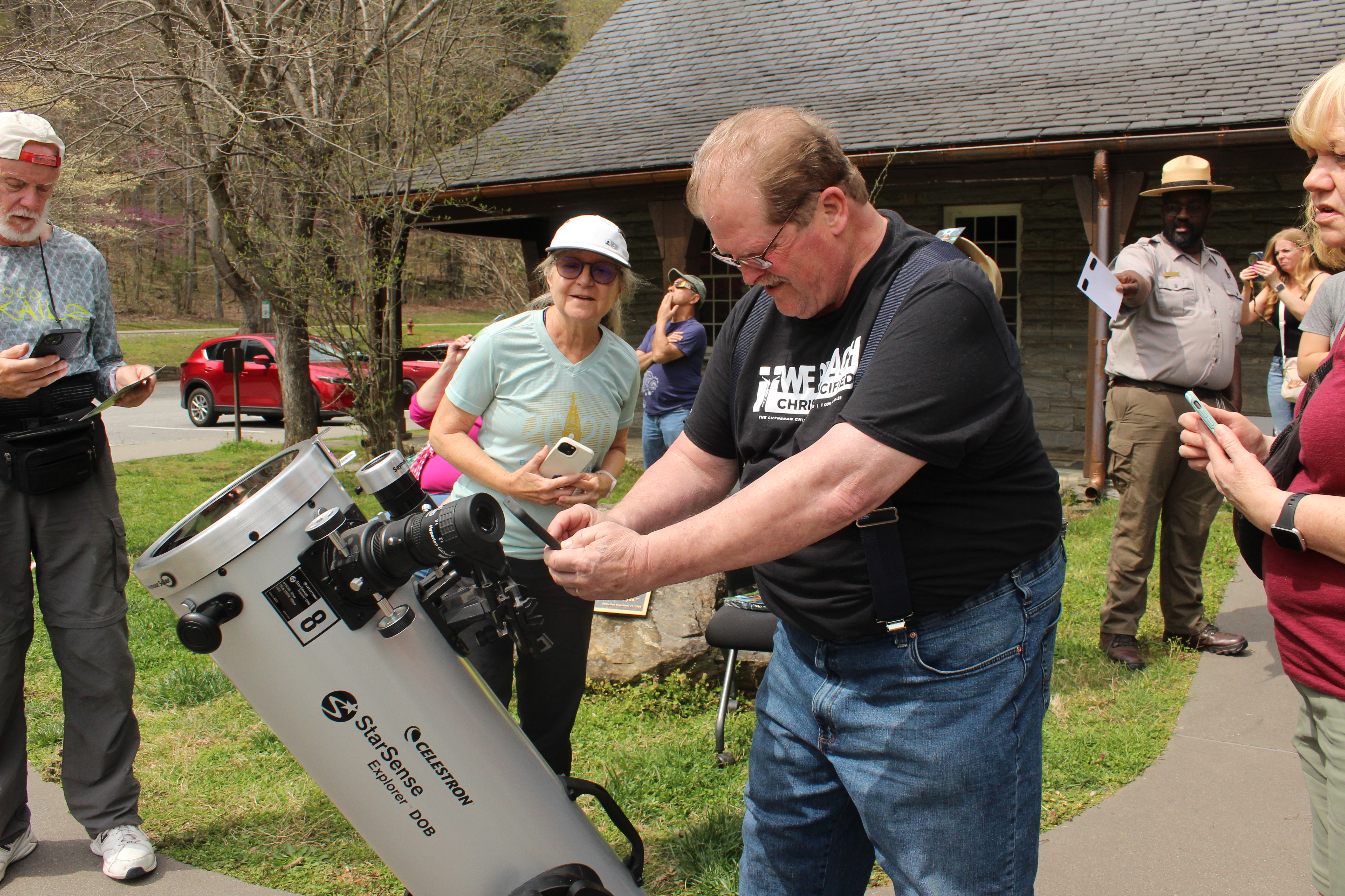 An Illinois resident named Tim visited the park for the eclipse on Monday, pictured here trying to capture a photo of the eclipse through the telescope provided by the National Park Service.